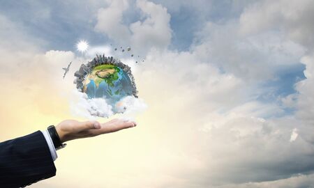 Close up of male hand holding our Earth planet. の写真素材