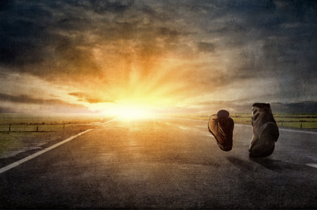 Pair of hikers boots walking on pathの写真素材