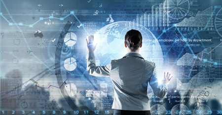 Back view of businesswoman working with modern virtual technologies Back view of businesswoman working with modern virtual technologies