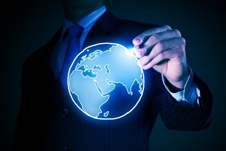 Chest view of businessman drawing on screen concept of travelingの写真素材