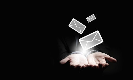 Close up of businessman hand holding email sign
