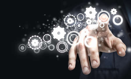 Businessman hand pressing icon of media screenの写真素材