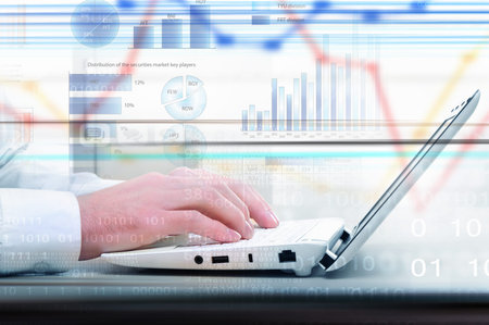 Hands of businessman running with fingers on laptop keyboard