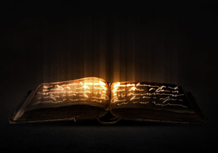 Old black magic book with lights on pages