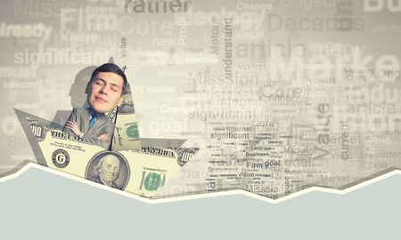 Businessman escapes from the crisis on a paper boatの写真素材