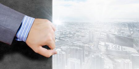 Close up of hand moving a part stone wallの写真素材
