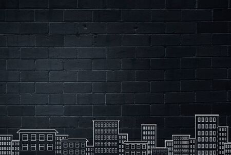 Close up of hand drawing urban buildings with markerの写真素材