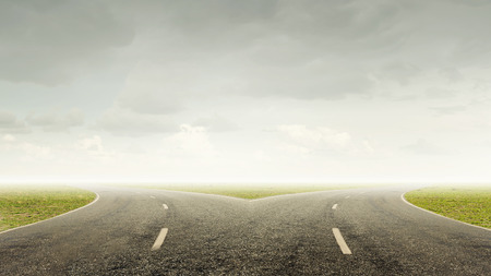 Concept of choice with crossroads spliting in two waysの写真素材