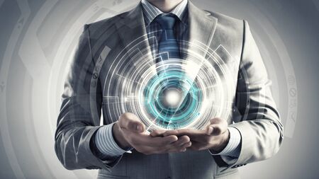 Close up of businessman holding media concept in palmsの写真素材
