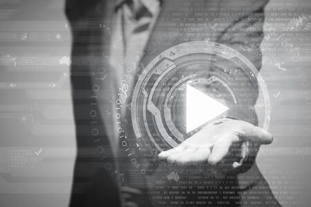 Businesswoman with media player button in palmの写真素材