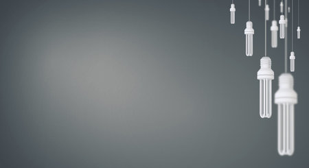 Many light bulbs on color background hanging from above