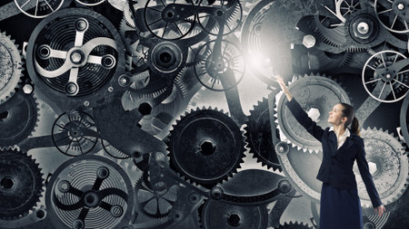 Young businesswoman reaching hand to touch gears mechanism