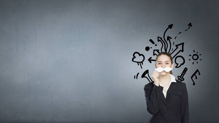 Happy cute girl trying male paper mustacheの写真素材