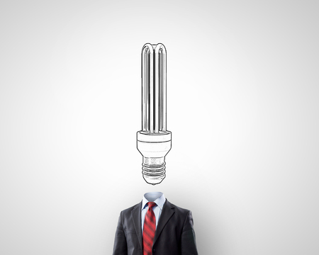Unrecognizable businessman with light bulb instead of headの写真素材