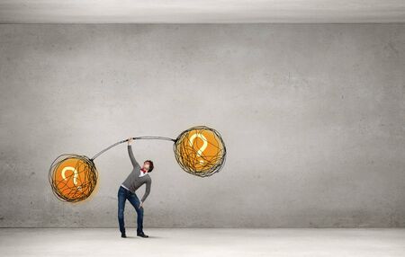 Confident businessman lifting above head sketched barbellの写真素材