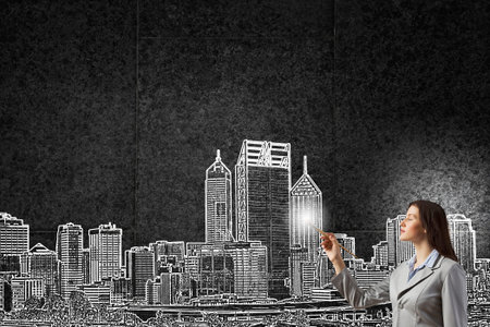 Young woman painting with brush construction projectの写真素材