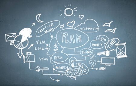 Close up of man hand drawing success strategy planの写真素材