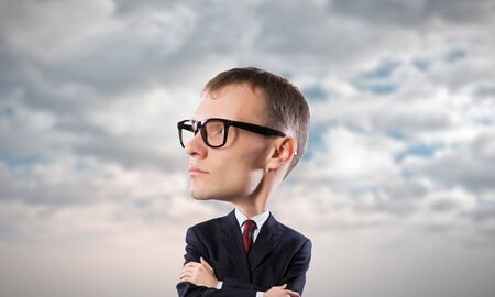 Young funny man in glasses with big headの写真素材