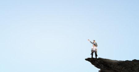 Businessman riding on back of his colleagueの写真素材