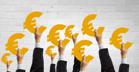 Group of business people holding euro currency signの写真素材