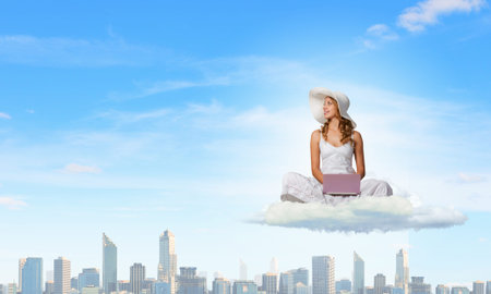 Young lady sitting on cloud and using laptop