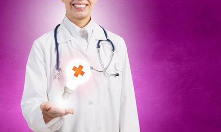 Close up of doctor hands with medicine cross signの写真素材