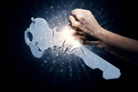 Hand of man crashing key with punchの写真素材