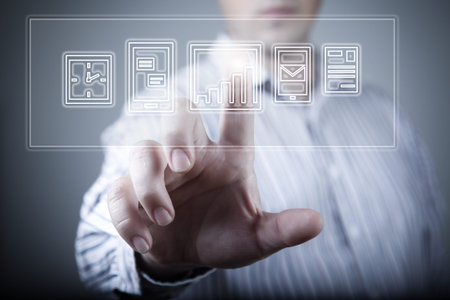 Hand of businessman pressing button on virtual screen