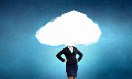 Unrecognizable businesswoman with cloud instead of headの写真素材