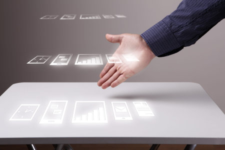 Hand of businessman presenting icons on virtual screen