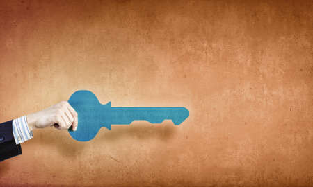 Hand of business person holding key cardの写真素材