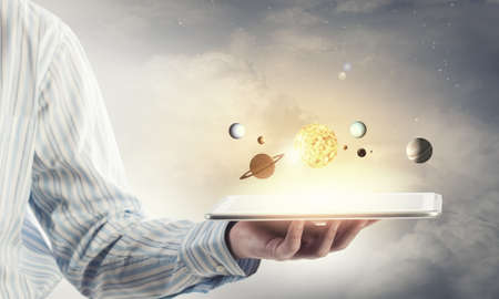 Close up of planet sun system in your handの写真素材