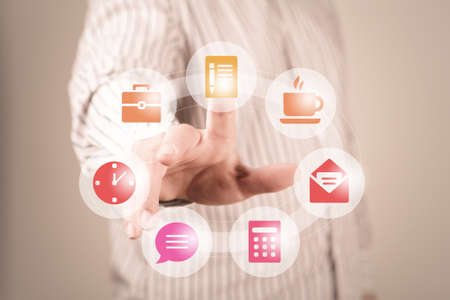 Hand of businessman pressing button on virtual screenの写真素材