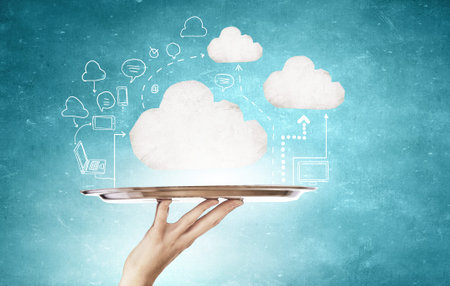 Hand holding tray with cloud computing concept