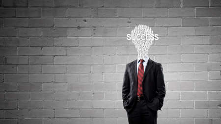 Businessman in suit with light bulb instead of headの写真素材