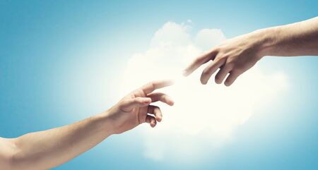 Close up of human hands touching with fingersの写真素材