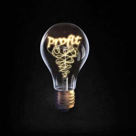 Glowing glass light bulb with word profit insideの写真素材