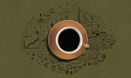 Top view of cup of coffee on color backgroundの写真素材