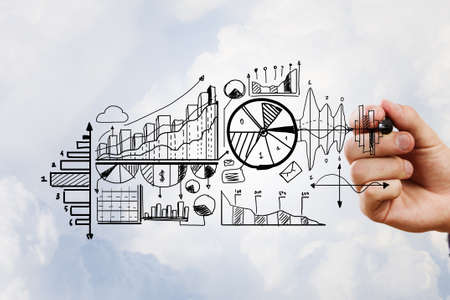 Person hand drawing business strategy plan on sky backgroundの写真素材