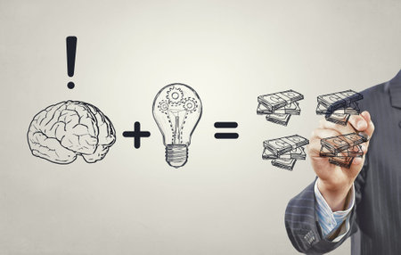 Close up of businessman drawing money making formulaの写真素材