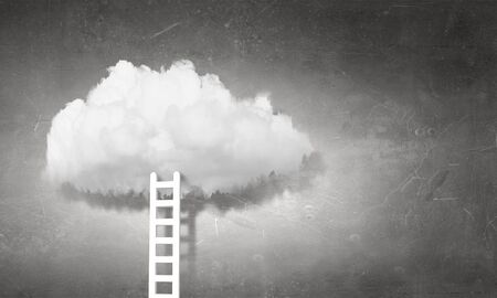 Conceptual image with ladder leading to white blank cloudの写真素材