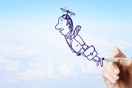 Man hand drawing caricature of businessman flying awayの写真素材