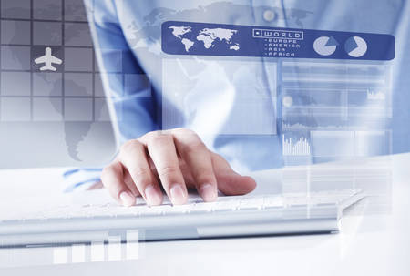 Hands of businessman working with keyboard and mouseの写真素材