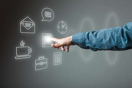Hand of businessman pressing button on virtual screenの写真素材