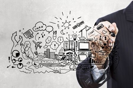 Close up of businessman drawing business sketches on screenの写真素材