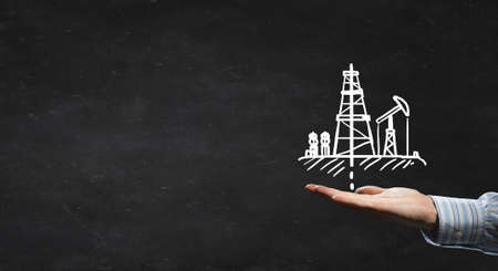 Drawn with chalk oil pump icon on blackboard backgroundの写真素材