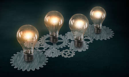 Glowing light bulbs and gears mechanism on dark backgroundの写真素材