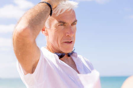 Handsome man on the beachの写真素材