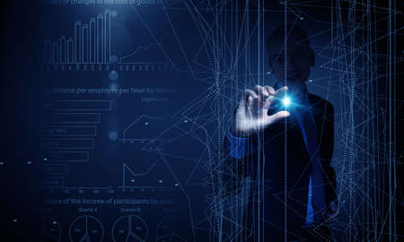 Young businessman pressing high tech circle icon on media screen