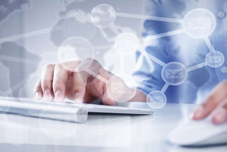 Hands of businessman working with keyboard and mouse